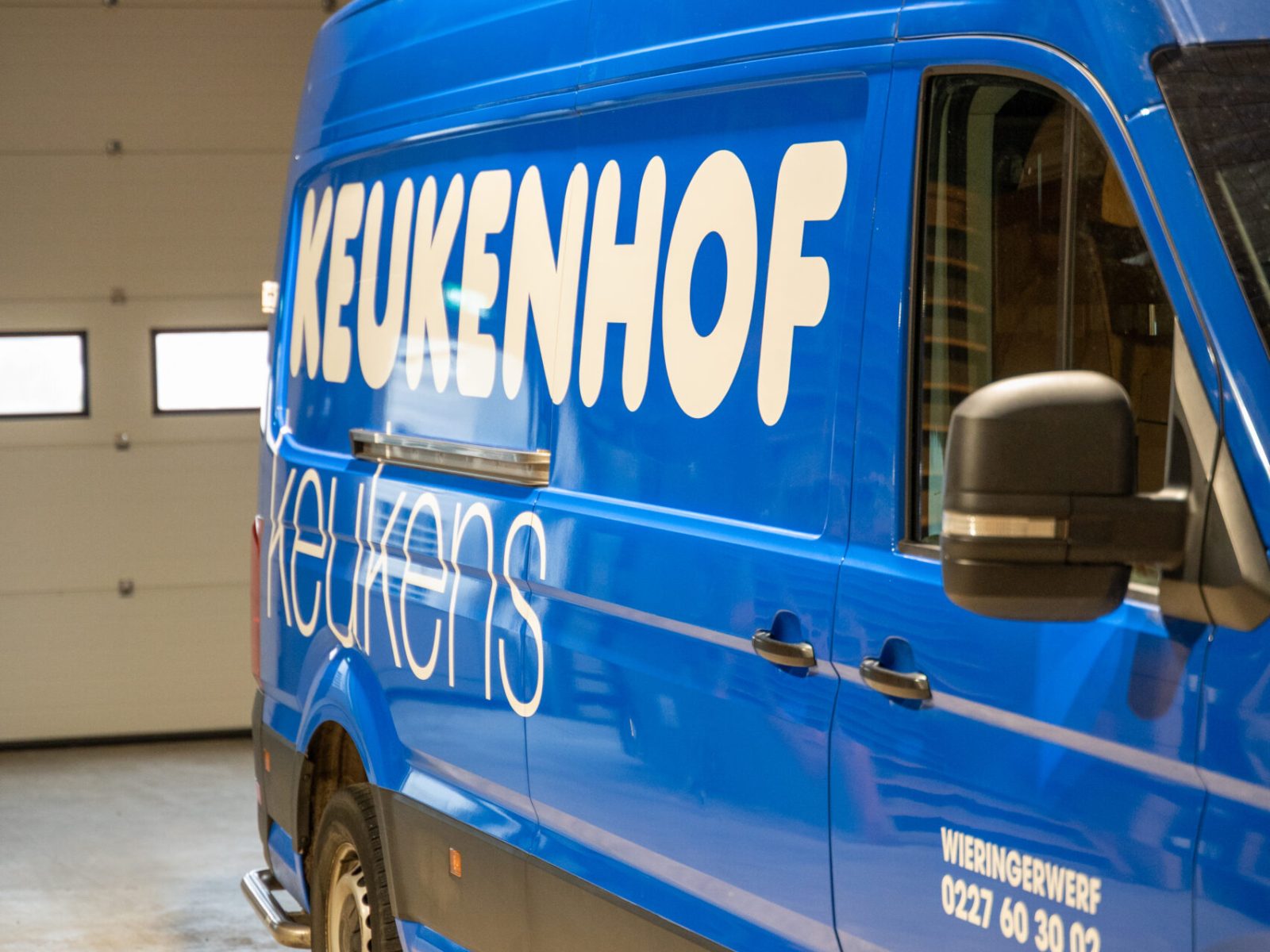 Keukenhof Keukens busbelettering zijaanzicht